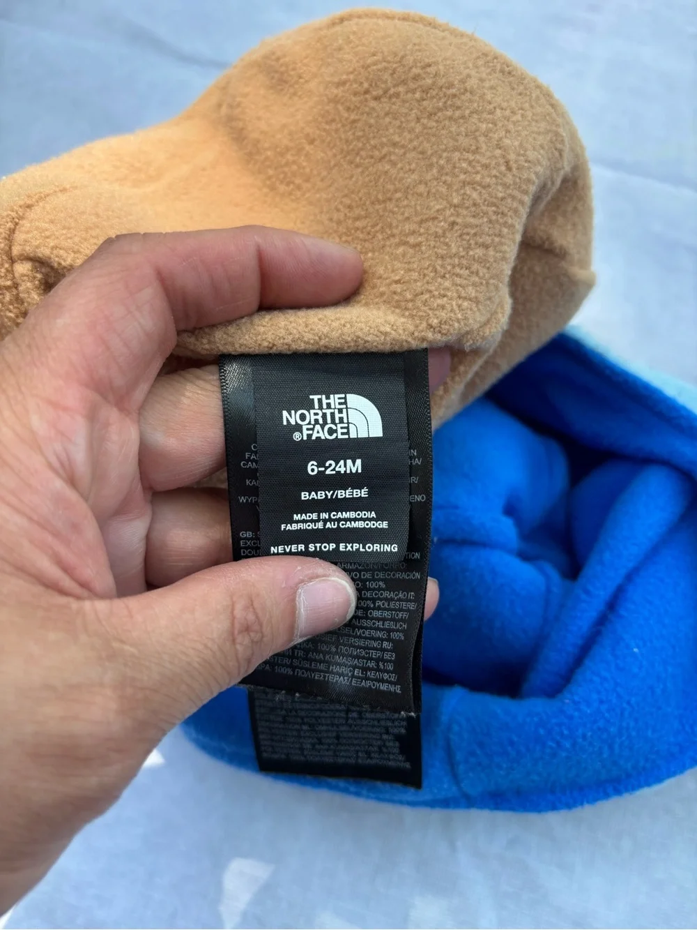 The North Face Fleece Earflap Pom-Pom Hats in Cream & Light Blue